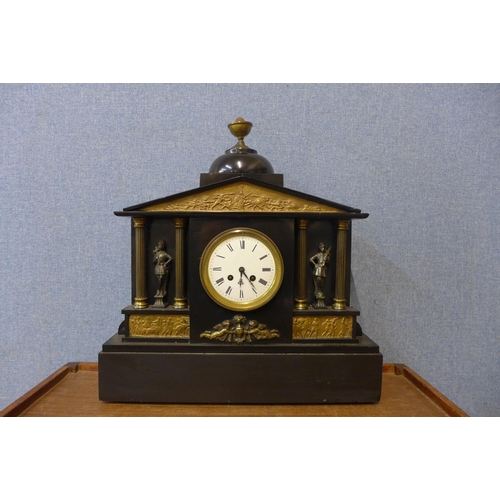 380 - A 19th Century French Belge noir and gilt metal architectural cased mantel clock