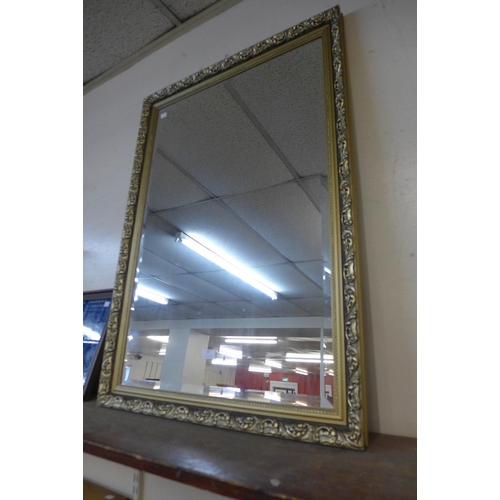 387 - A gilt framed mirror