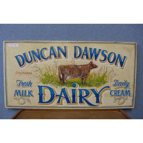 402 - A painted wooden Duncan Dawson Dairy sign