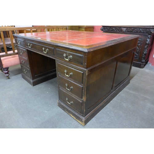 41 - A George III style mahogany and red leather topped partners desk