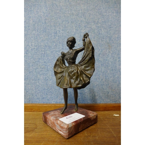 410 - A small Art Deco style bronze figure of a lady, manner of Franz Bergman, on rouge marble socle