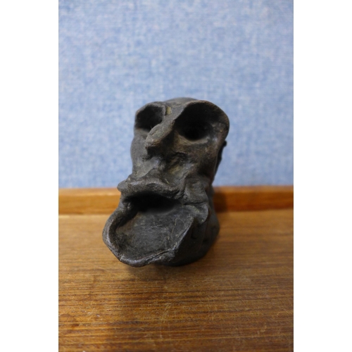 412 - A small Surrealist bronze head