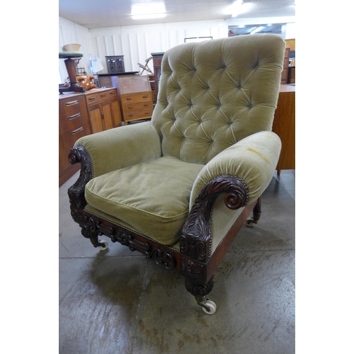 52 - An early Victorian Howard & Sons style carved mahogany and fabric upholstered country house armchair... 