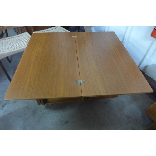 57 - A McIntosh Tristor teak fold over cabinet/table