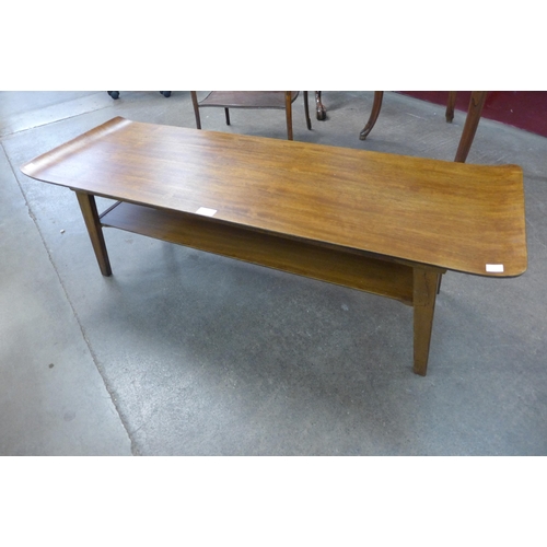 76 - A teak coffee table