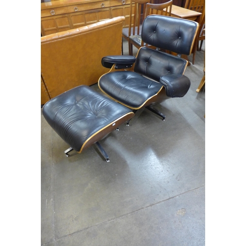 86 - A Charles & Ray Eames style black leather and simulated rosewood revolving lounge chair and stool