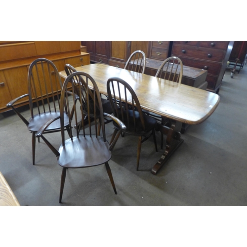 91 - An Ercol Golden Dawn elm and beech refectory table and six Quaker chairs