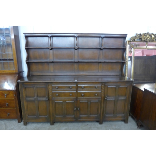 92 - A large Ercol Golden Dawn elm and beech dresser