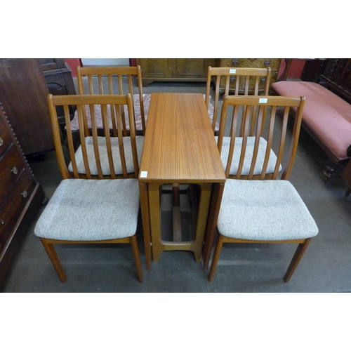 94 - A set of four Danish Vamdrup Stolefabrik teak dining chairs and a teak drop leaf table