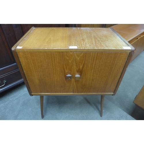 99 - A teak two door record cabinet