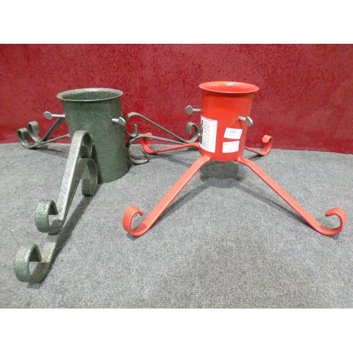 3262 - Two metal Christmas tree stands; one red, one green