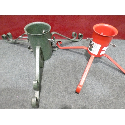 3262 - Two metal Christmas tree stands; one red, one green