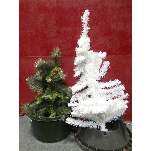 3268 - Two plastic tree bases and a Christmas tree tops