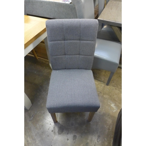 1528 - A set of four grey upholstered dining chairs