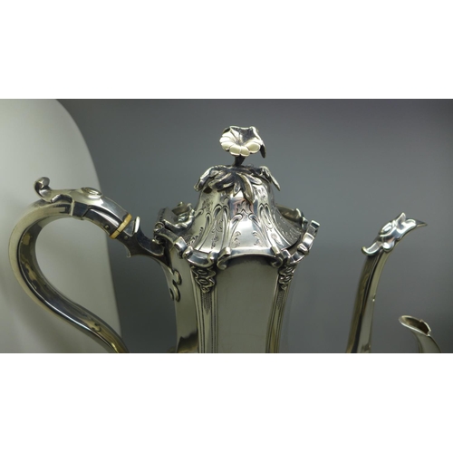 616 - A mid Victorian EPNS engraved coffee pot, a Roberts & Belk's EPNS coffee pot with pierced gallery