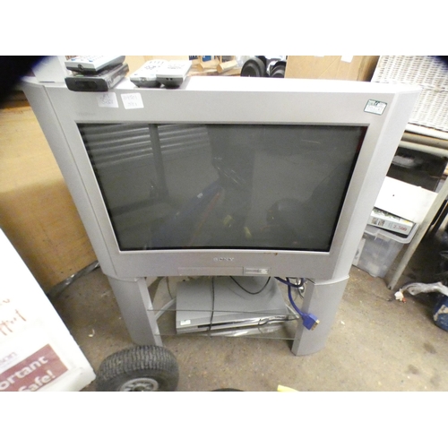 2455 - Sony Triatron colour TV on stand with Sony DVD player and remote controls
