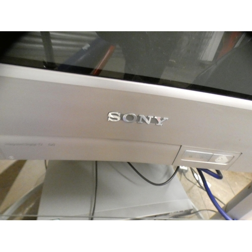 2455 - Sony Triatron colour TV on stand with Sony DVD player and remote controls