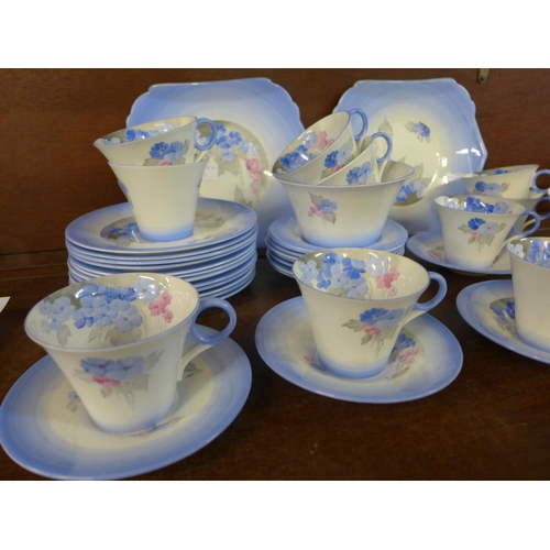 718 - A Shelley Phlox tea service, twelve cups, saucers and side plates, cream jug, sugar and two larger p... 