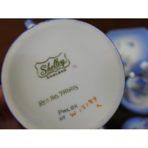 718 - A Shelley Phlox tea service, twelve cups, saucers and side plates, cream jug, sugar and two larger p... 