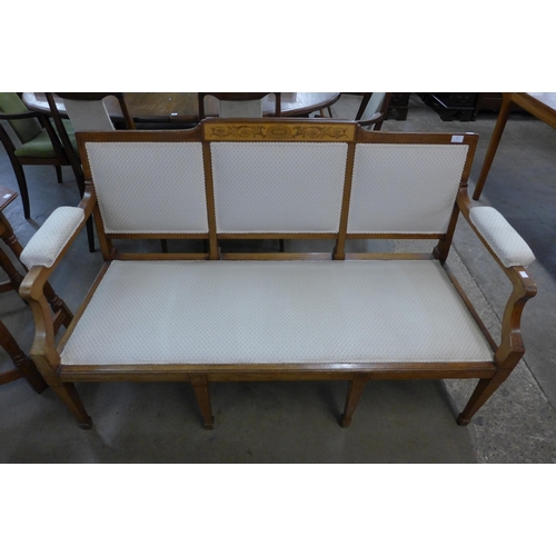 17 - An Edward VII Sheraton Revival mahogany and satinwood inlaid settee