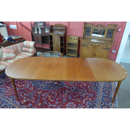 53 - A Swedish Hugo Troeds teak Ove extending dining table, designed by Nils Jonsson