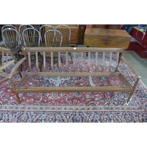 85 - A Danish France & Son teak settee and armchair, designed by Grete Jalk