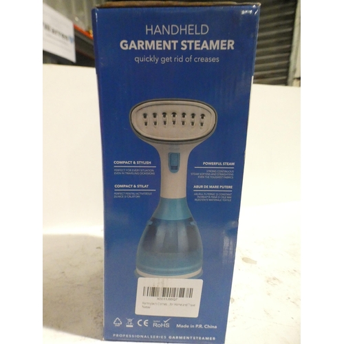 3089 - A white and blue 1700w hand held garment steamer (model: MW-801)