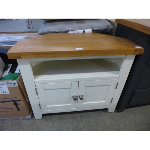 1783 - A Hampshire cream painted oak corner TV unit, damaged * this lot is subject to VAT