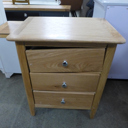 1791 - A Chester Oak three drawer bedside chest - Damaged *This Lot is Subject to VAT*