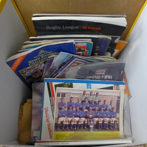 687 - A collection of sports programmes and leaflets including football and rugby, some signed