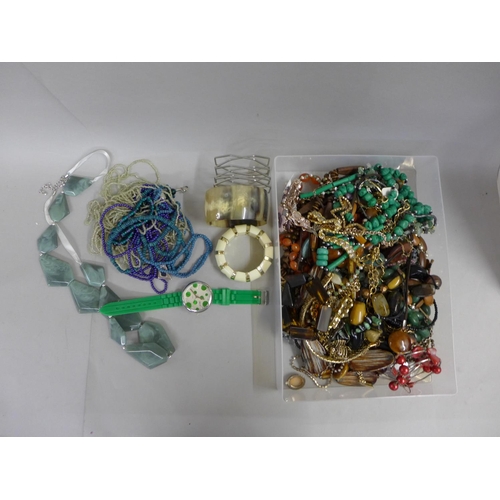 694 - A collection of costume jewellery including beaded necklaces, bangles, etc.