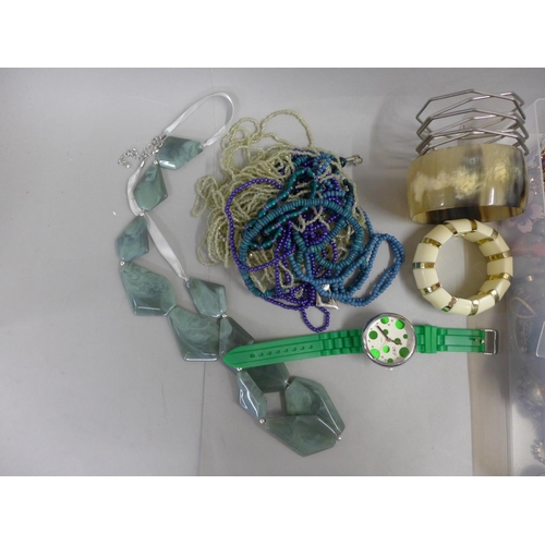 694 - A collection of costume jewellery including beaded necklaces, bangles, etc.