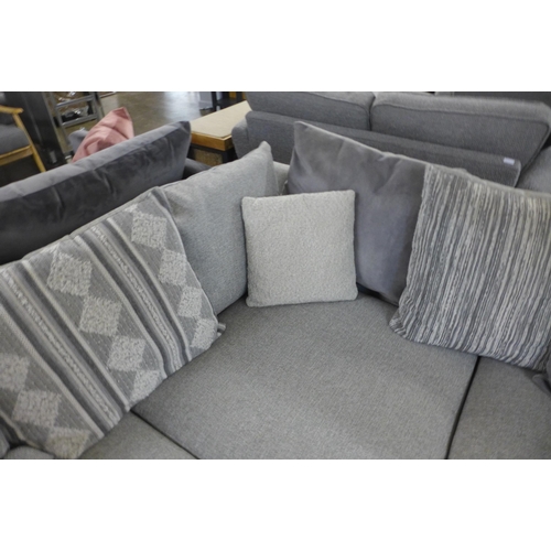 1307 - A designer grey upholstered corner sofa with footstool (different feet on footstool)