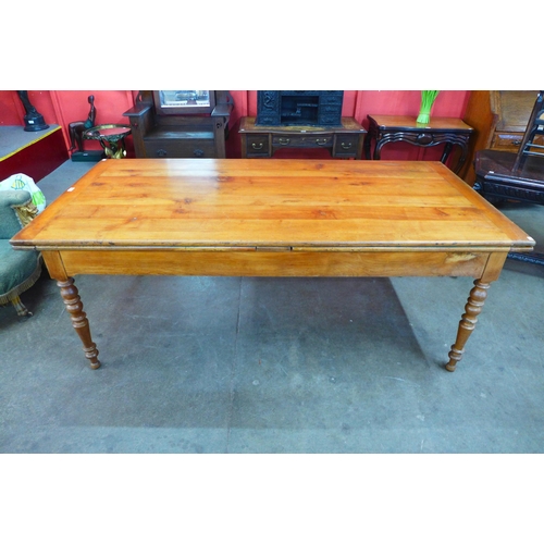 11 - A 19th Century French cherrywood extending farmhouse table