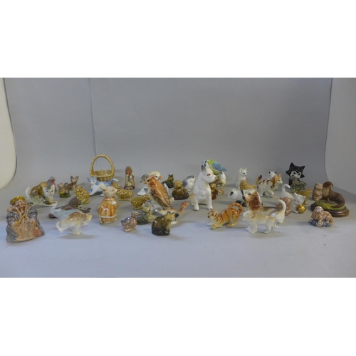 678 - A collection of Wade Whimsies, a Beswick Blue-tit and other small figures