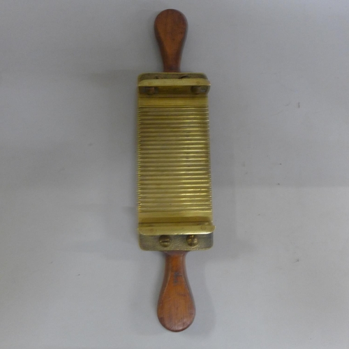 696 - Two wood and brass mounted pill rollers