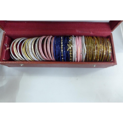 721 - A collection of costume bracelets and bangles