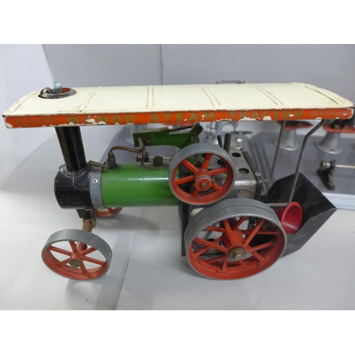 740 - An early 1960's traction engine with instructions and accessories including a line shaft, model fan,... 
