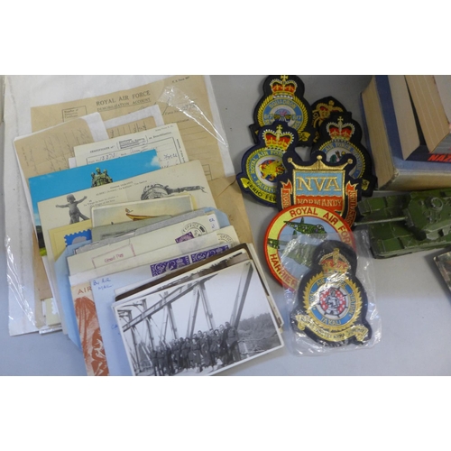 753 - Militaria; box of military ephemera including postcards, official documents, cloth badges, Dinky 651... 