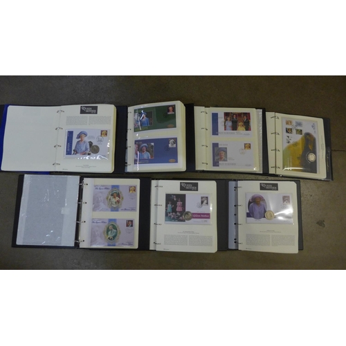 768 - Seven folders with 85 coin covers including silver proofs, £5 coins, £2 coins, crowns, $1, etc., plu... 