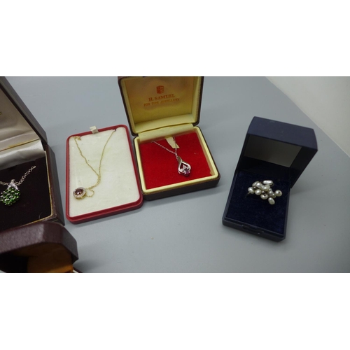 925 - Silver pendants and rings including one opal set