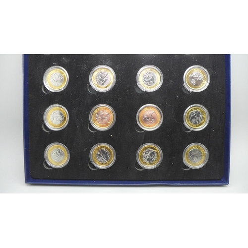 935 - A collection of sixteen Rio 2016 Olympic 1 Real coins, boxed and cased