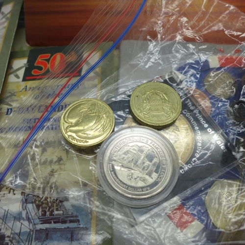 941 - A collection of coin covers and uncirculated coins