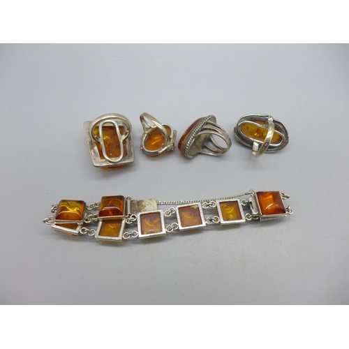 953 - Four silver and amber rings and a silver and amber bracelet, (three rings and the bracelet with impo... 