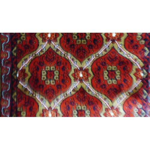 1504 - A red ground full pile Turkish runner, all over design 300cm x 80cm