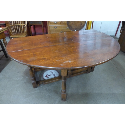 10 - A George III style oak gateleg wake table