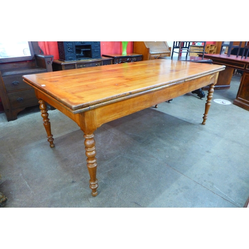 11 - A 19th Century French cherrywood extending farmhouse table