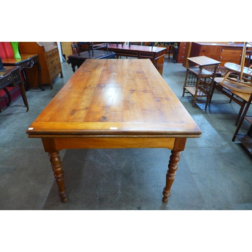 11 - A 19th Century French cherrywood extending farmhouse table