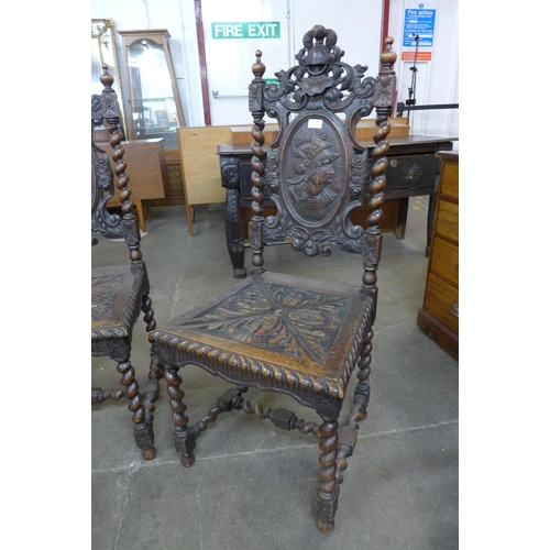 32 - A pair of 19th Century Flemish carved oak side chairs