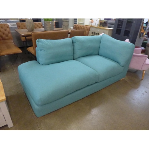 1308 - A turquoise upholstered corner sofa/chaise, slight damage to back